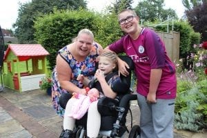 Family in the garden at Francis House
