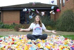 Rachel Astill throwing knitted chicks into the air
