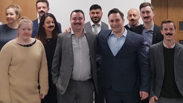 Staff at Interlink Recruitment wearing moustaches for Tash for Cash