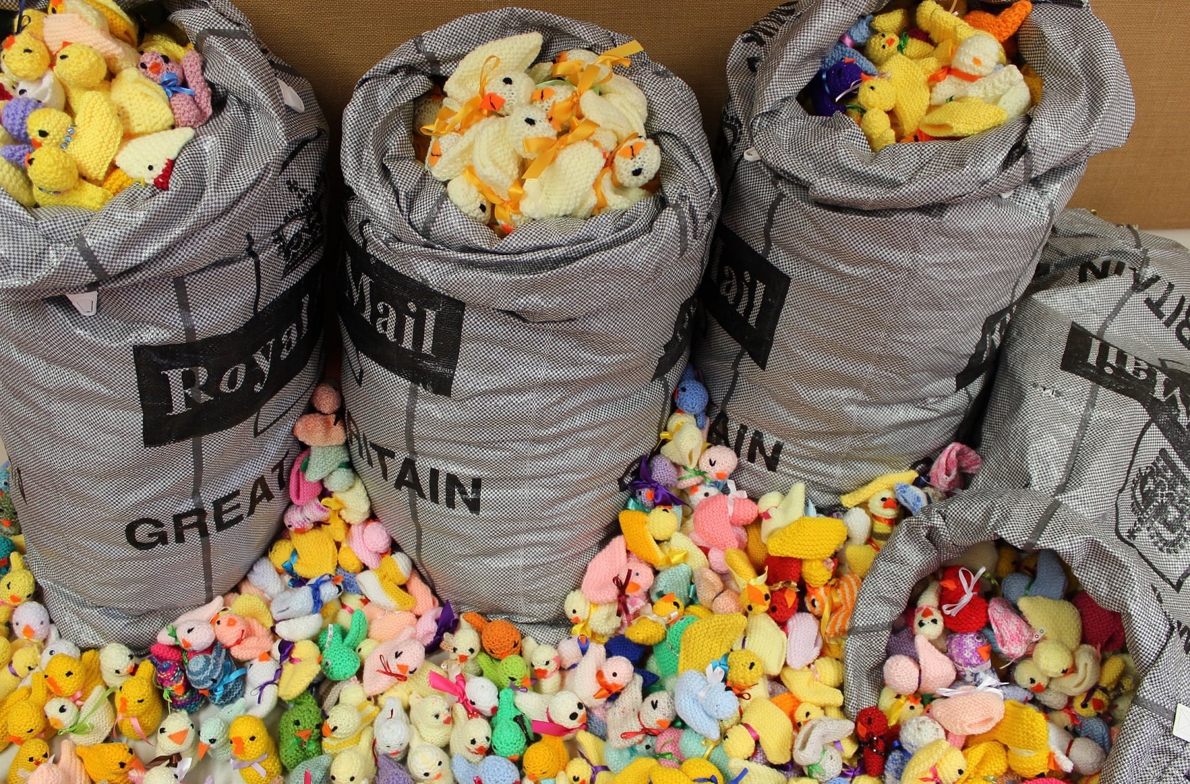 Post sacks full of knitted chicks