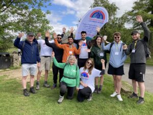 A group of walkers cheer at the Cheshire Three Peaks finish point