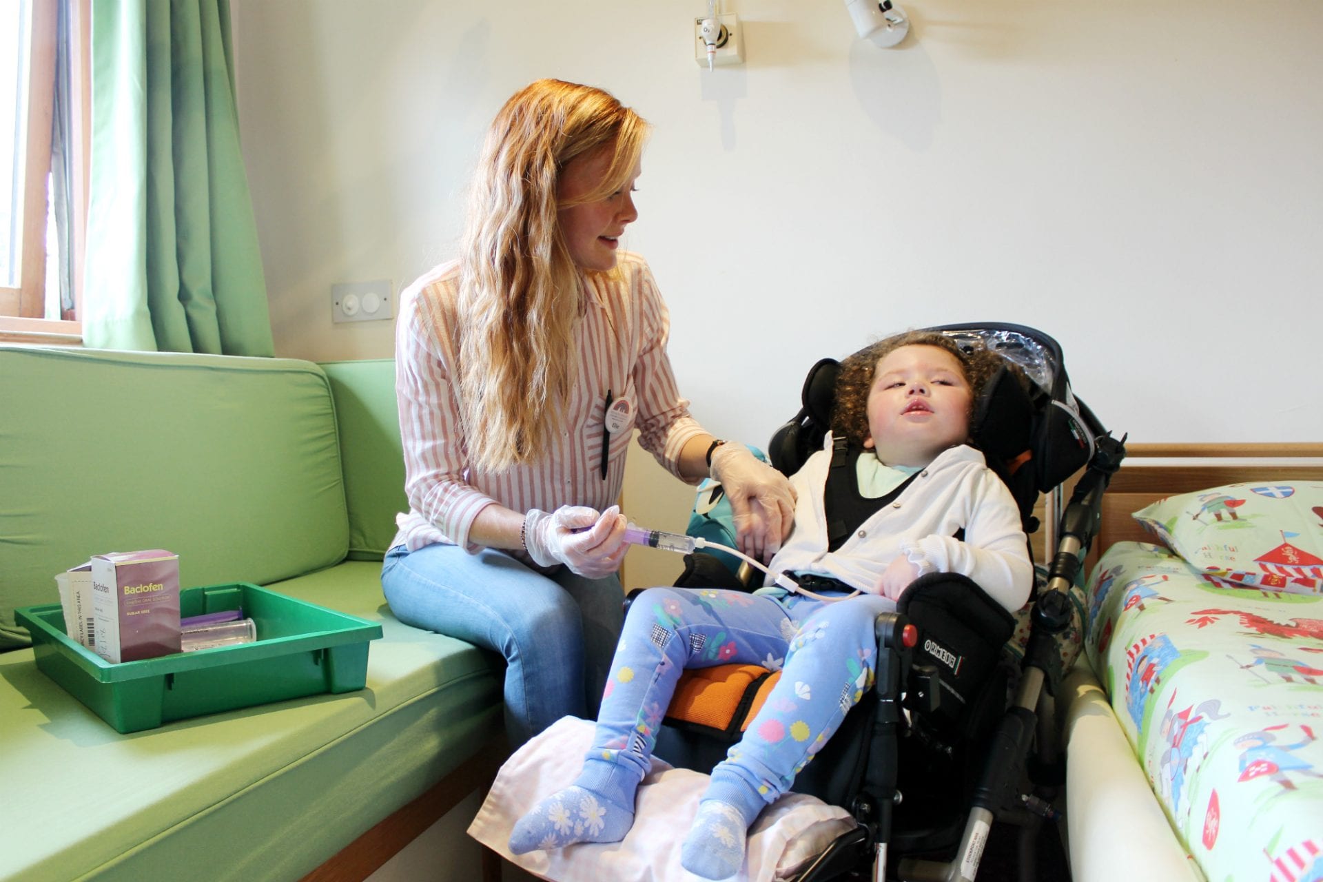 Care team member with tube fed child
