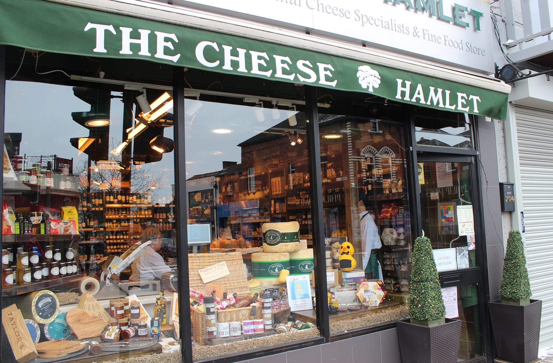Cheese Hamlet window with knitted chick on display