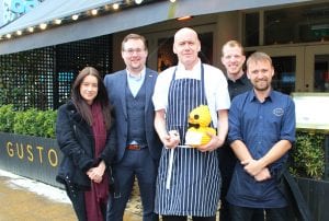 Staff from Gusto Didsbury with knitted chick