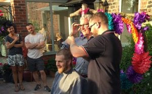 Rob having his hair cut after growing it