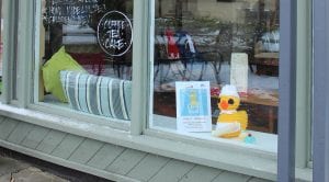 Home cafe with knitted chick in window