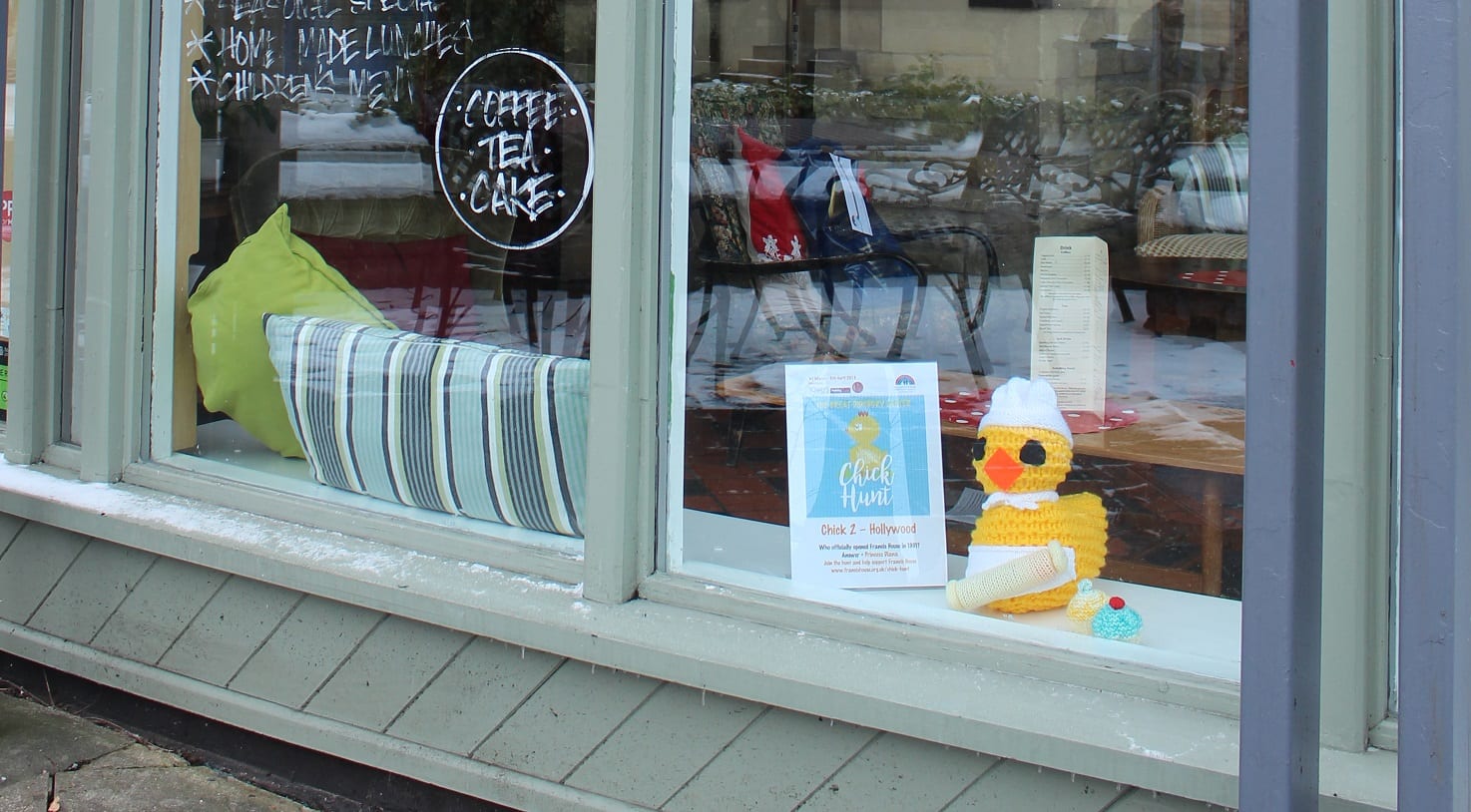 Home cafe with knitted chick in window