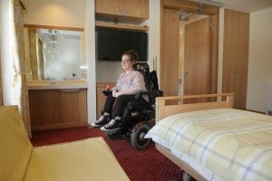 Kate in one of the bedrooms in Francis Lodge