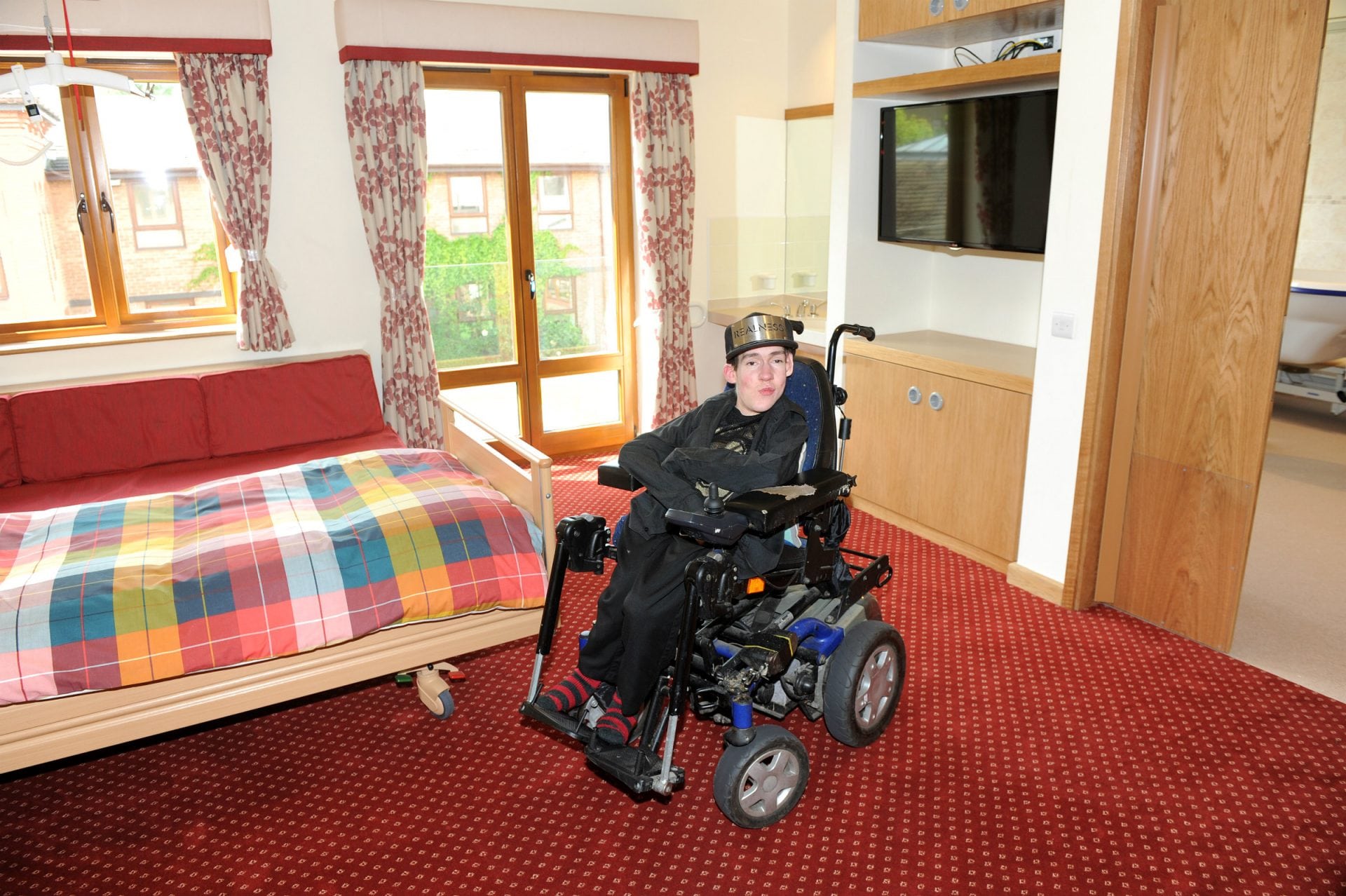 Kyle in one of the bedrooms in Francis Lodge