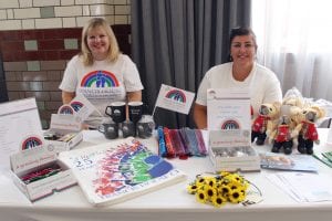 Volunteers selling merchandise at the Ladies Lunch