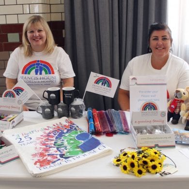 Volunteers selling merchandise at the Ladies Lunch