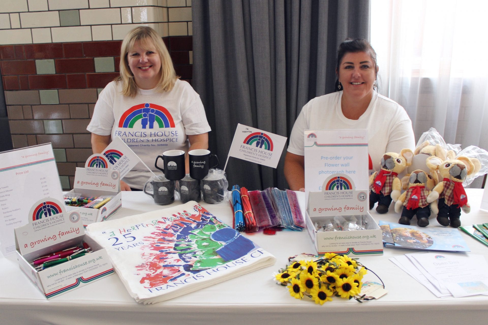 Volunteers selling merchandise at the Ladies Lunch