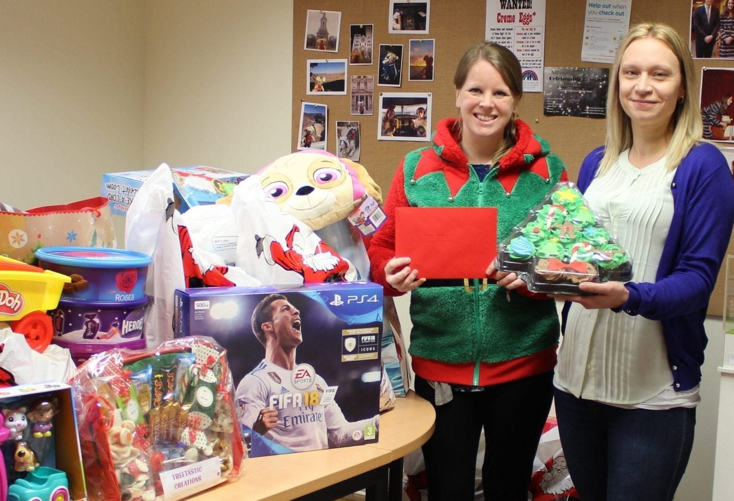 Emma from Francis House with supporter Krystina and gifts of toys