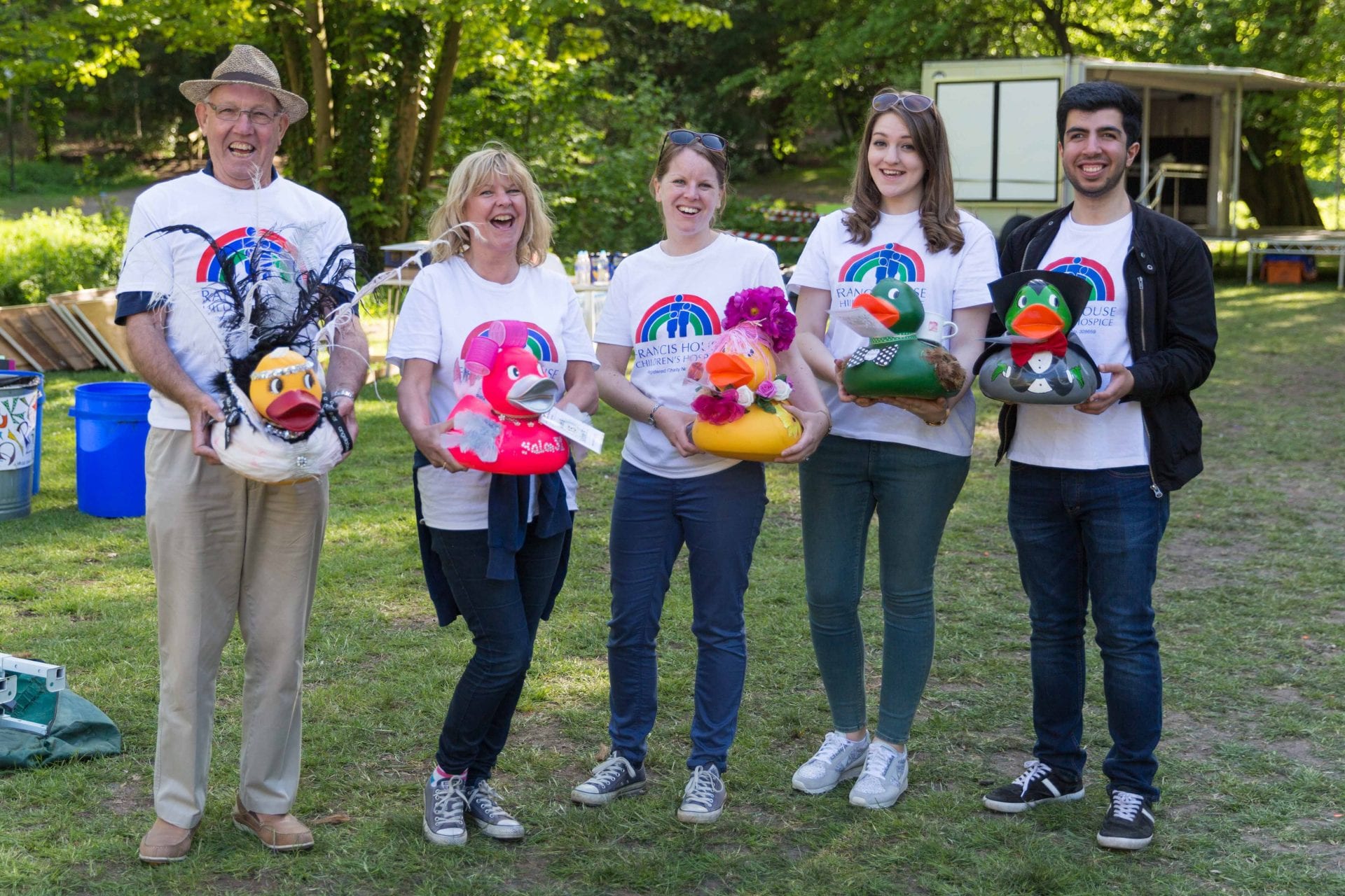 People holding plastic ducks at Woodford and Bramhall Rotary Duck Race