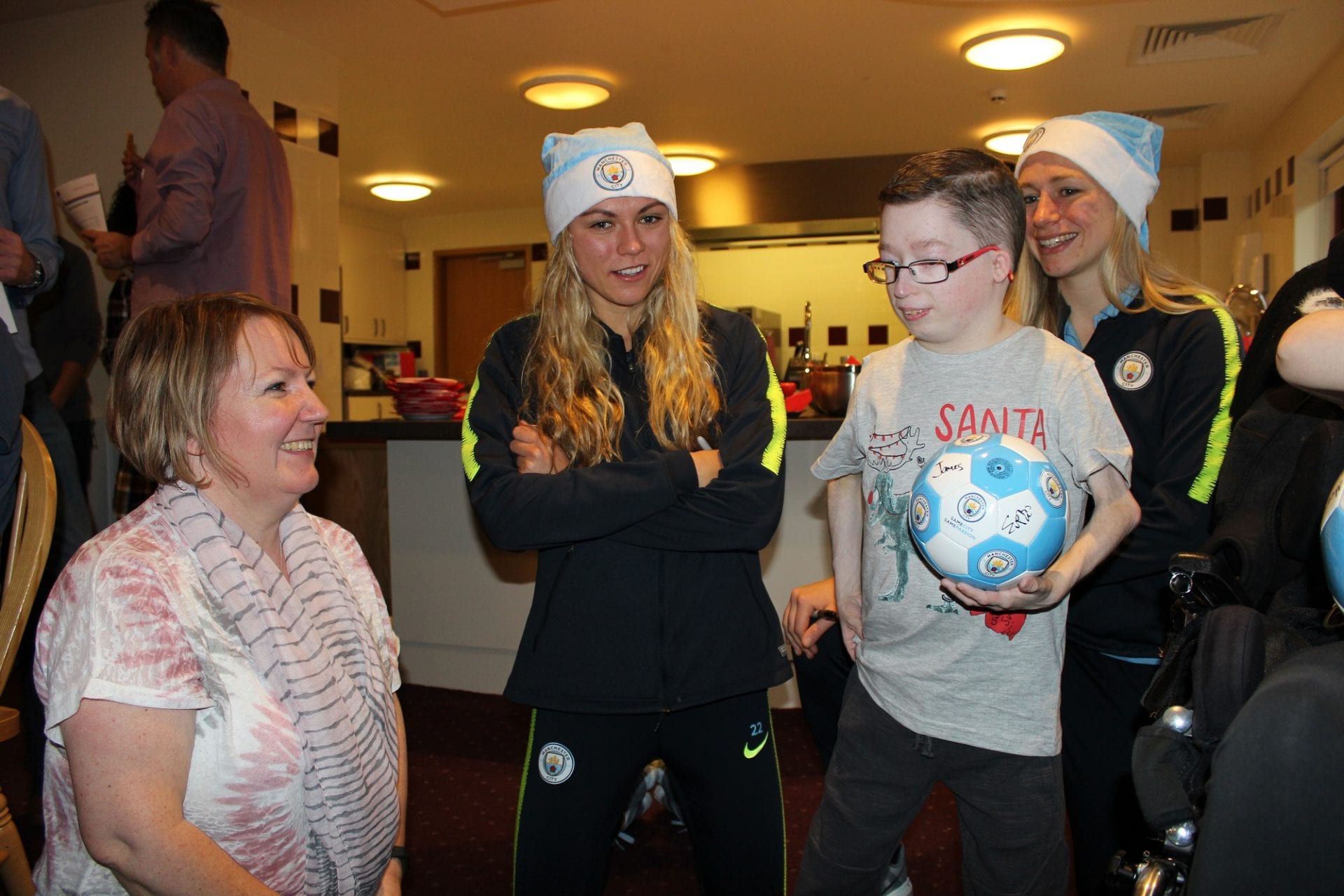 Man City midfielder Claire Emslie and forward Pauline Bremer with Jo and James
