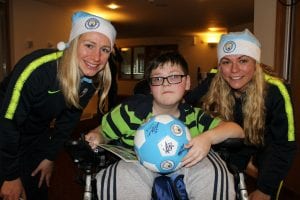 Manchester City forward Pauline Bremer with Travis and midfielder Claire Emslie