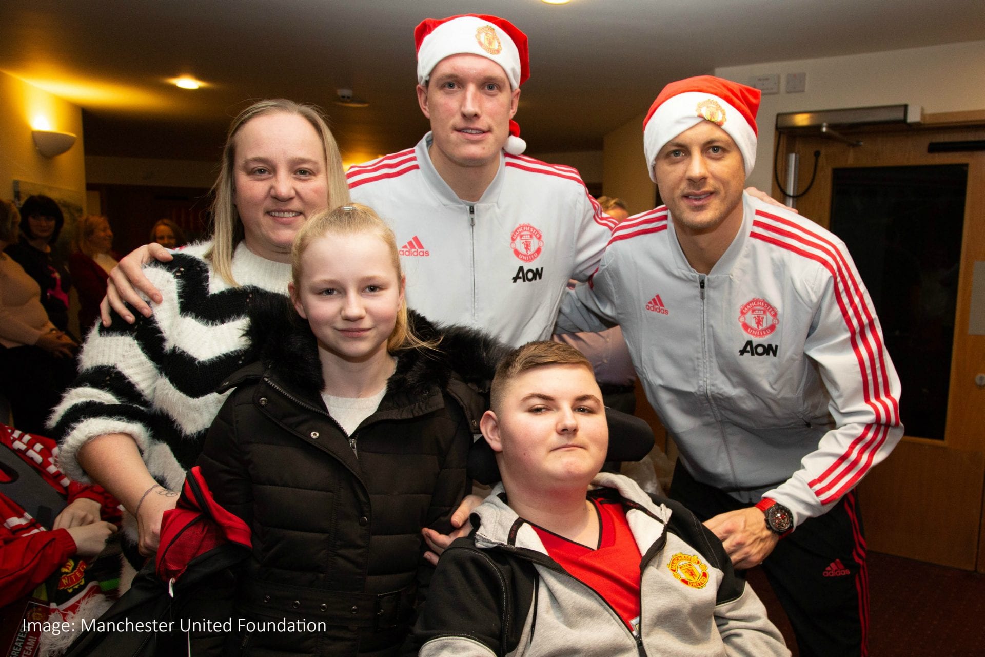 Zach and family with Phil Jones and Nemanja Matic