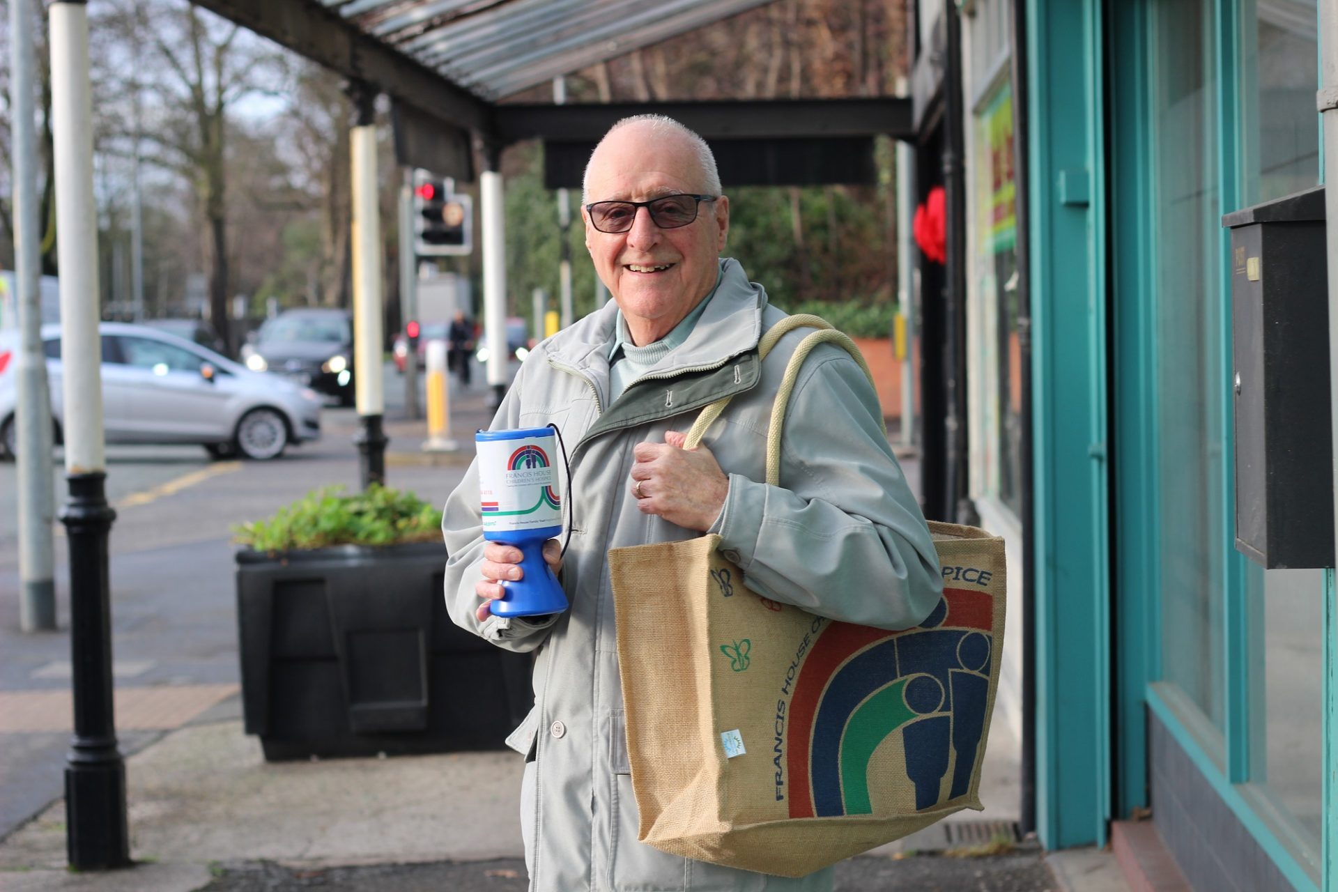 Alan Dickinson distributing charity tins