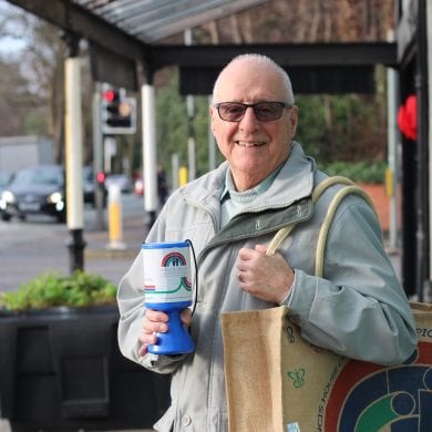 Alan distributing charity tins