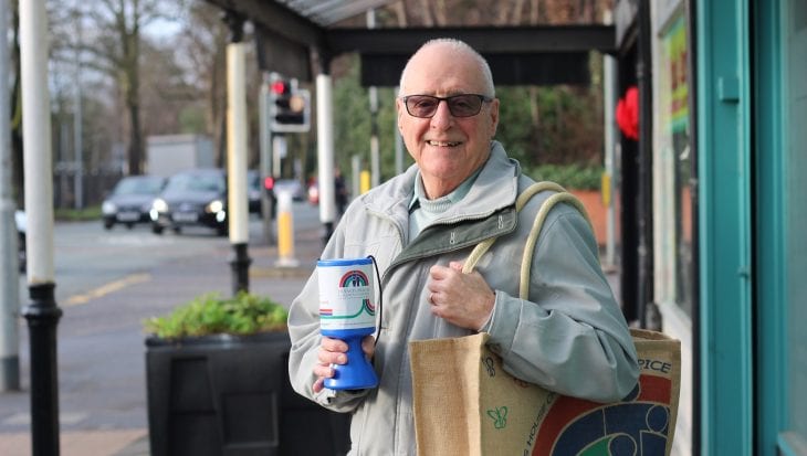 Alan distributing charity tins