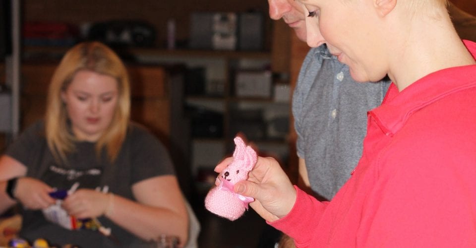 Barclays staff packing knitted bunnies