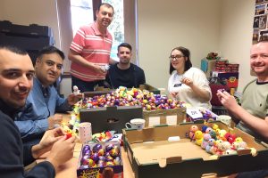 Barclays staff stuffing chicks with creme eggs.