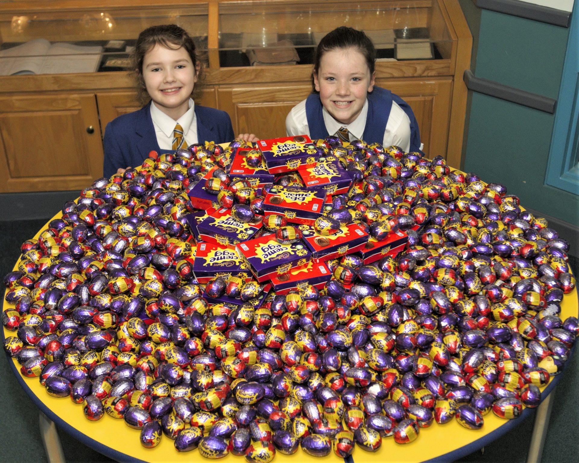 Caia and Olivia with creme egg donation from Lady Barn House School.