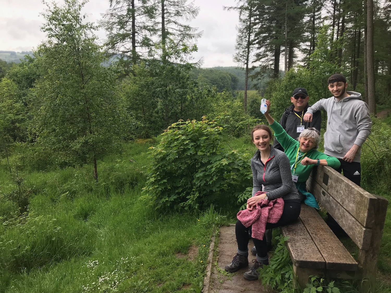 Family sat on bench in Cheshire countryside