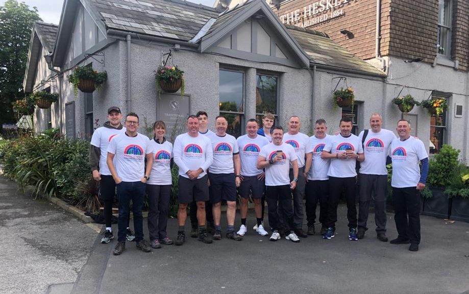 Group outside pub wearing Francis House tee shirts.