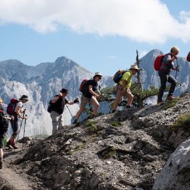 People trekking up mountains