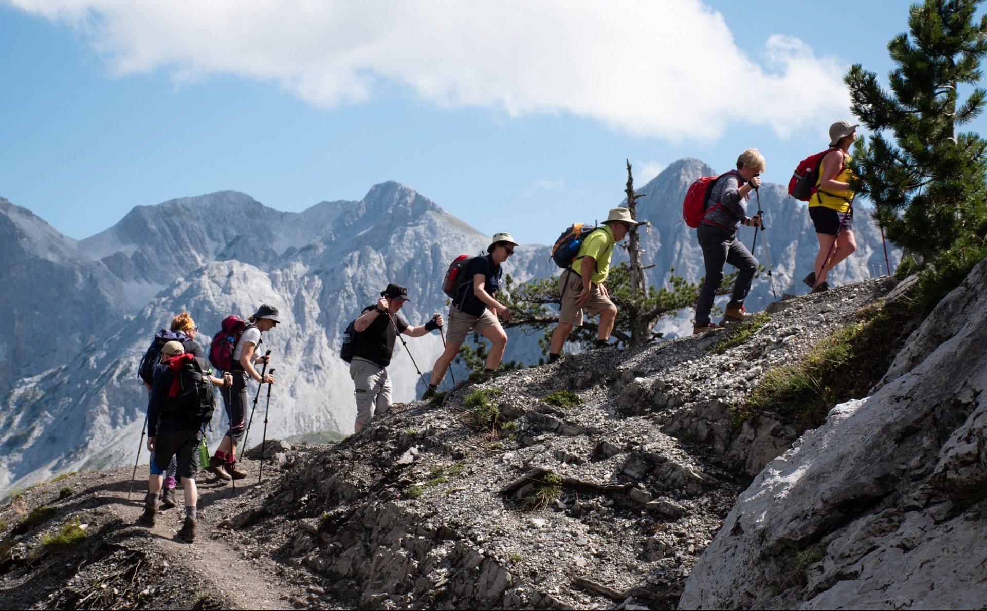 People trekking up mountains