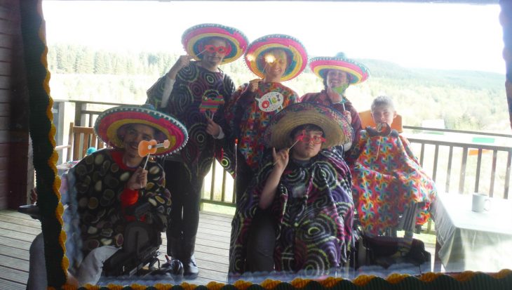 People in Mexican party clothes