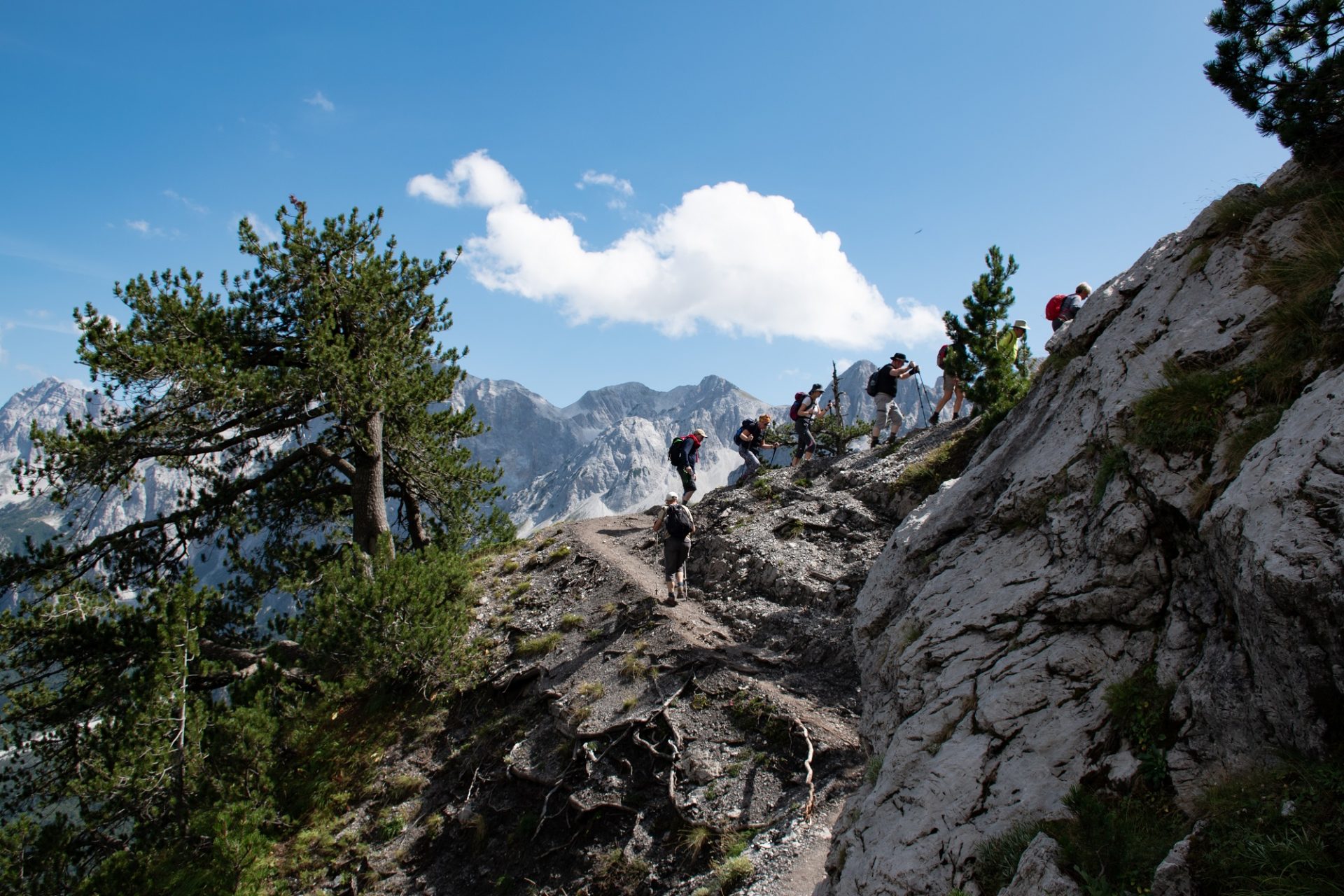 Group of walkers trek the Valbona Pass