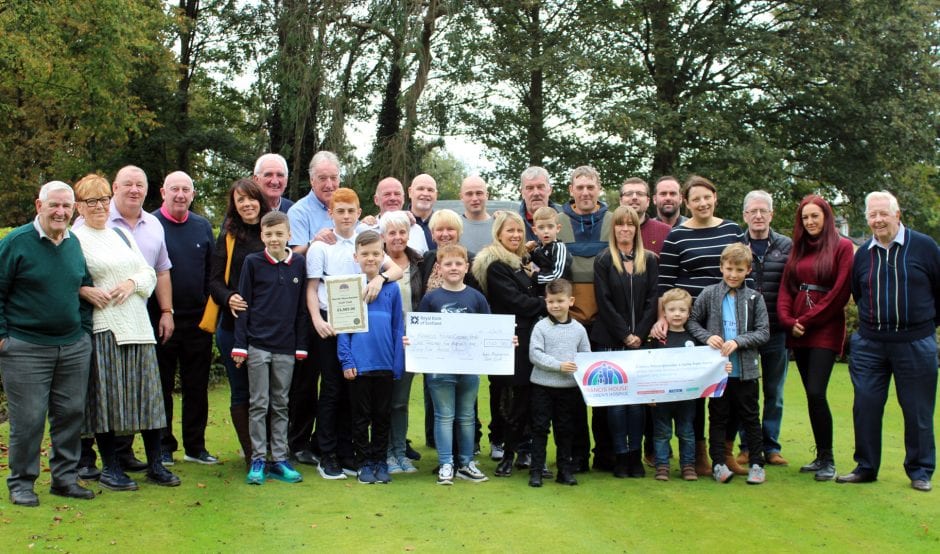 Family members with cheque for Francis House