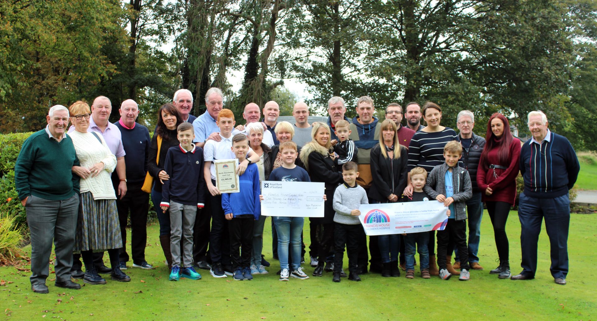 Family members with cheque for Francis House