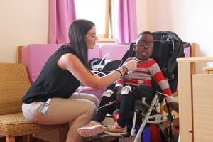 Nurse caring for child at Francis House