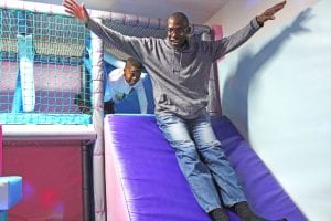 Adult and child playing in soft play room Francis House