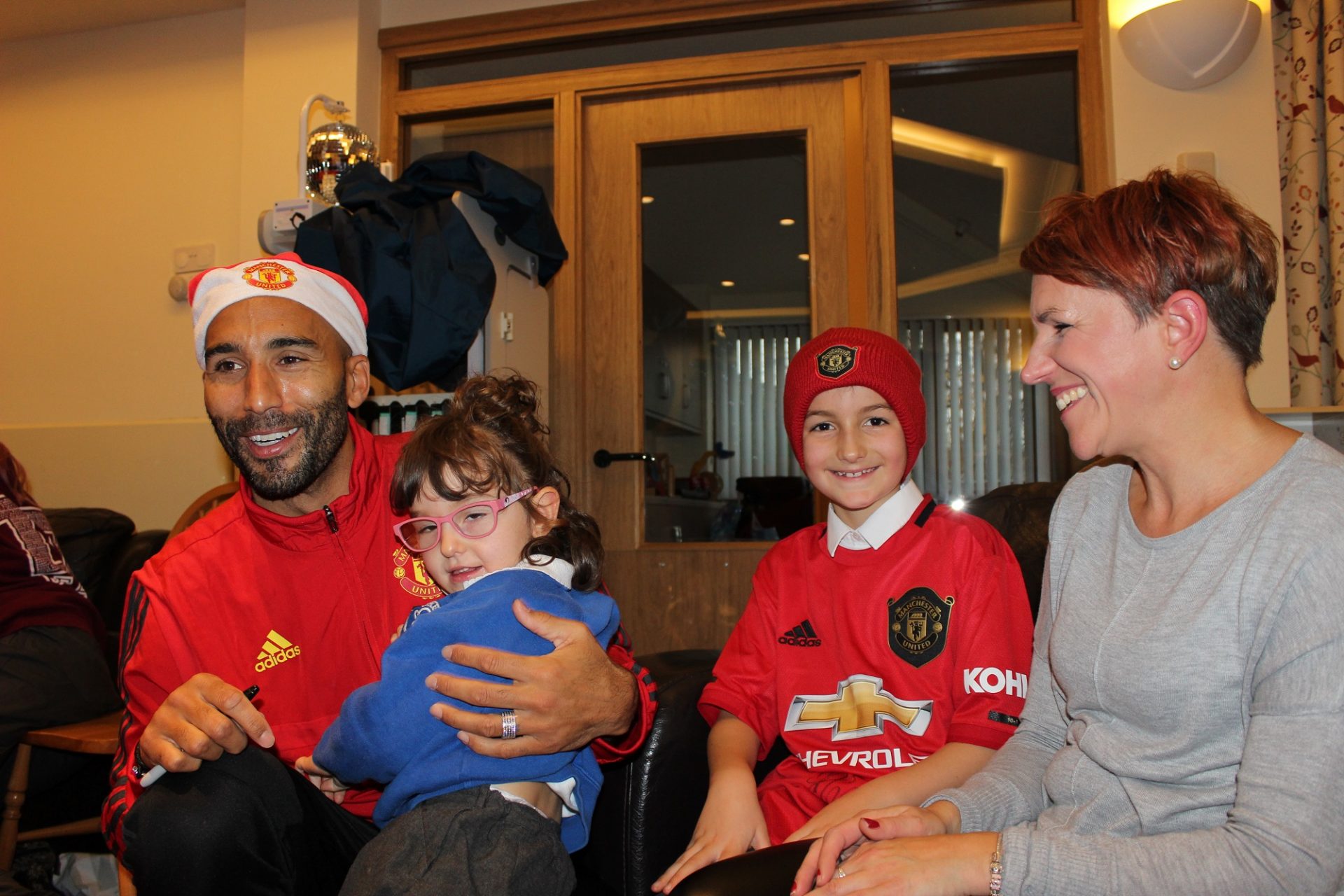 Mancheter United player with Francis House family