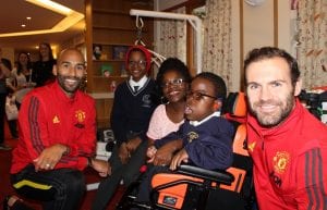 Manchester United players with Francis House family