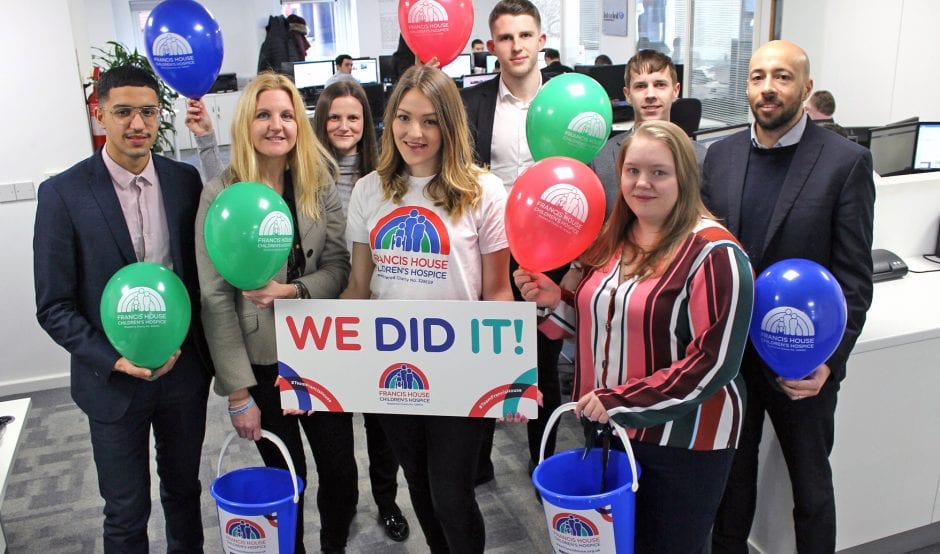 Staff with charity buckets and balloons