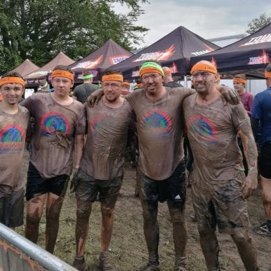 Muddy people after Tough Mudder