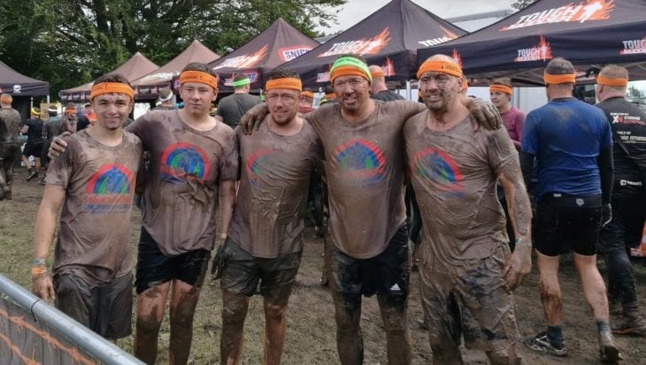 Muddy people after Tough Mudder