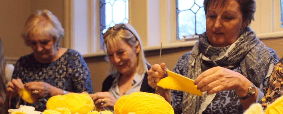 Ladies knitting Easter chicks for Francis House