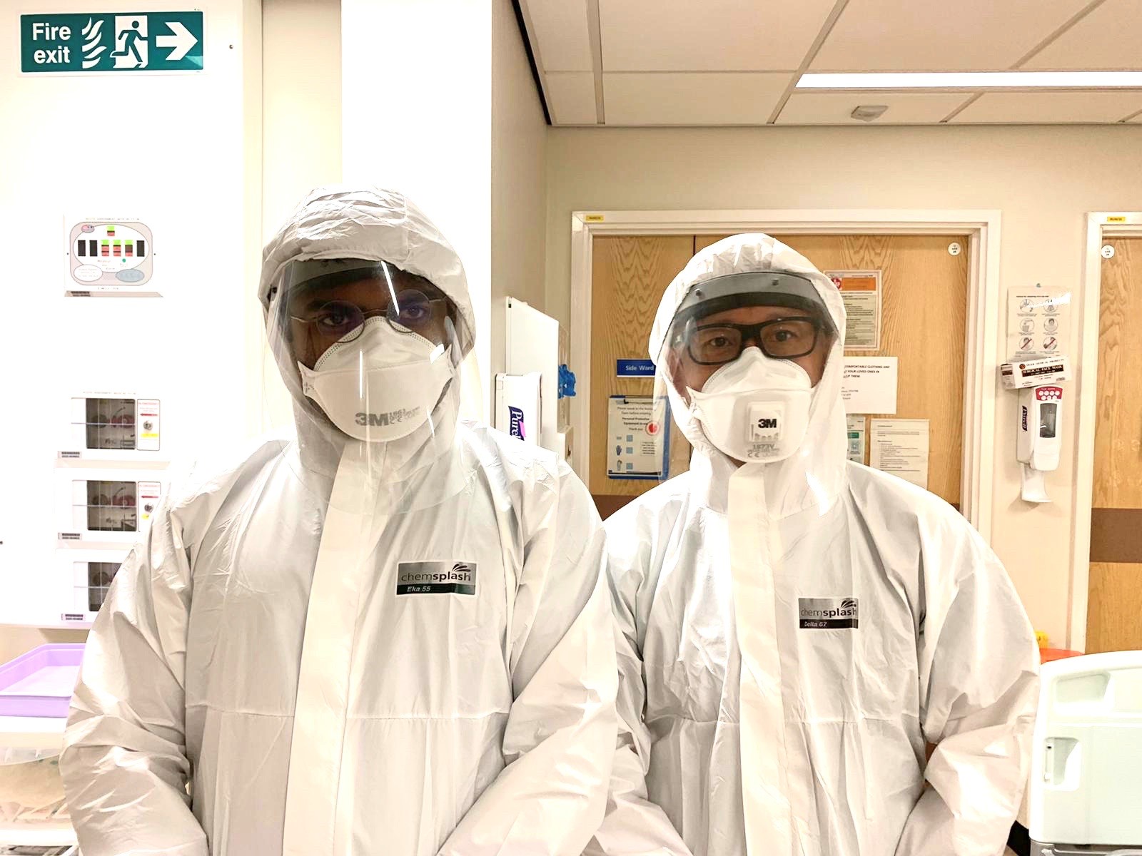 L-R Registar Dr Nevan Meghani and Georges Ng Man Kwong in full PPE taken during peak of Covid admissions
