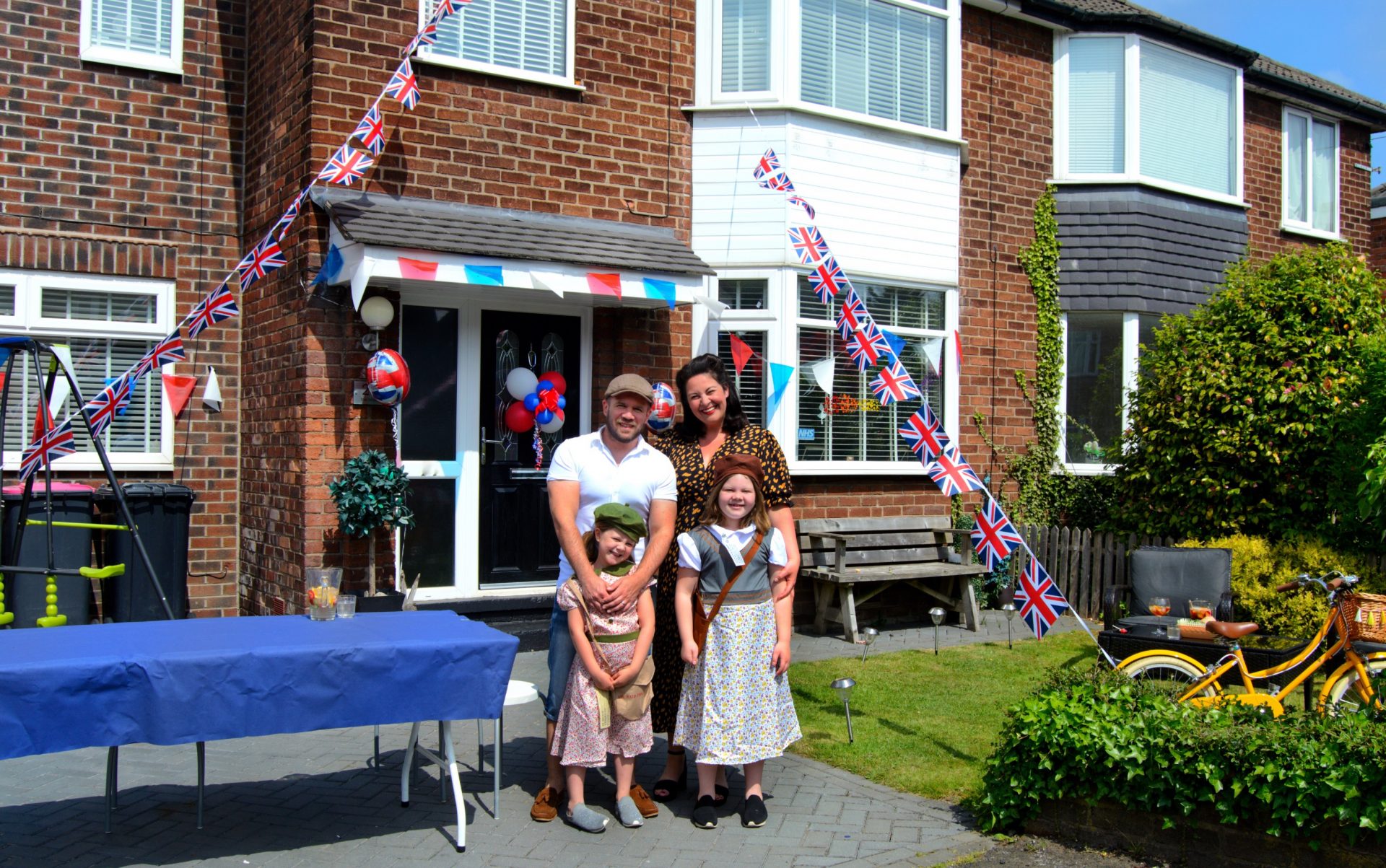 Family stood outside house