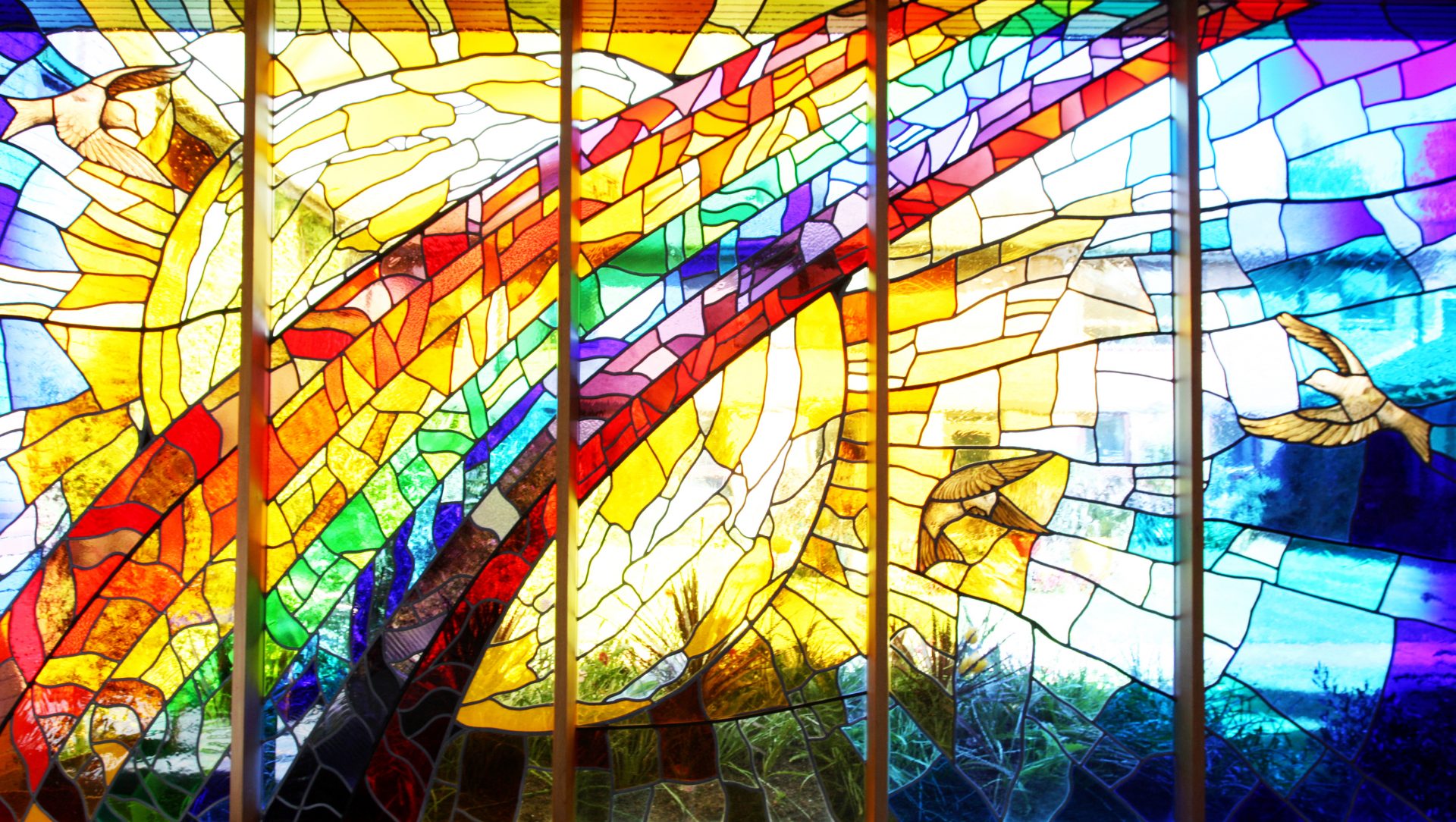 Chapel stained glass window with rainbow