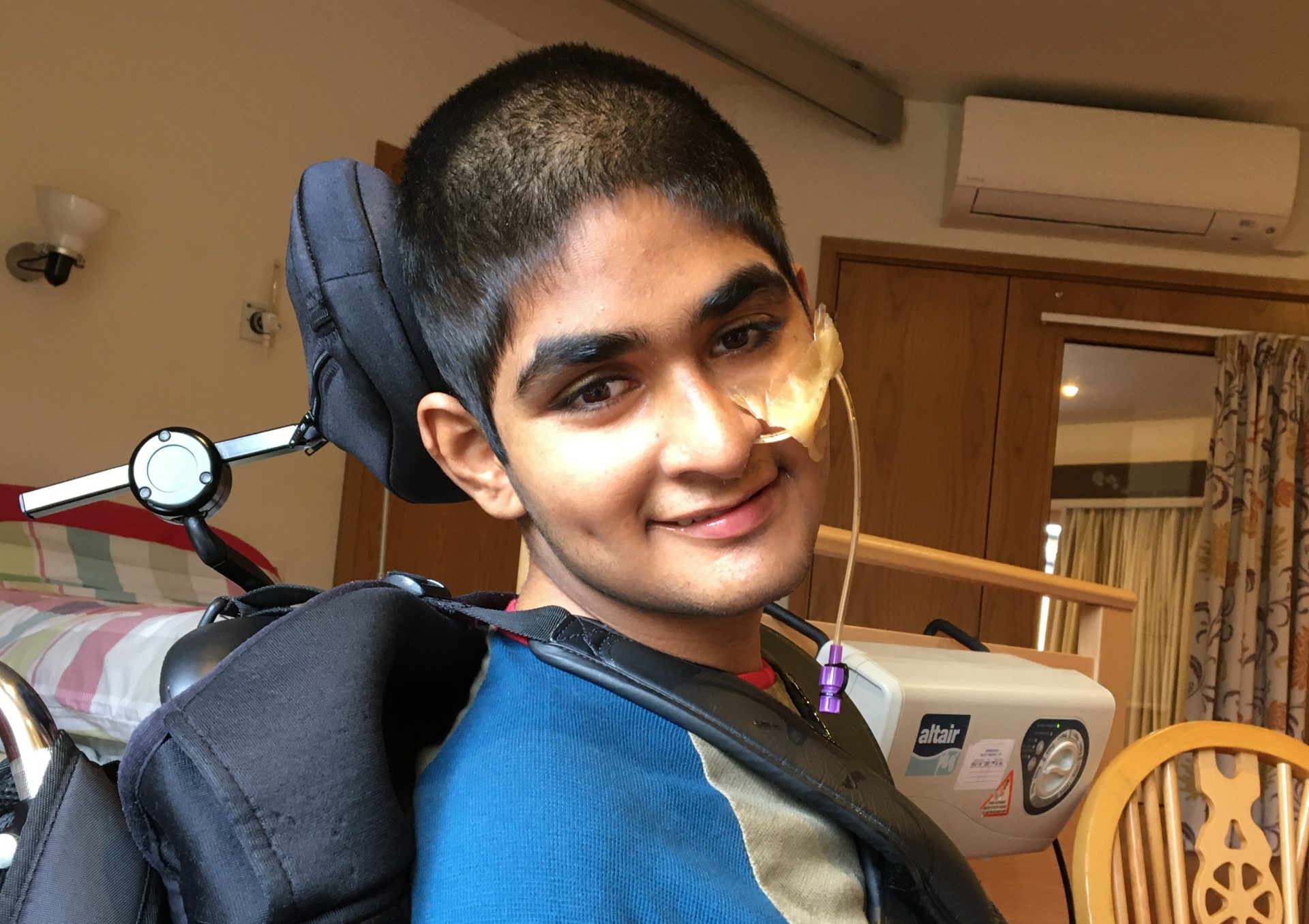 Boy in wheelchair smiling
