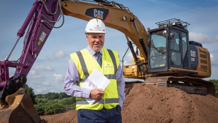 Neil Goodwin stood in front of digger