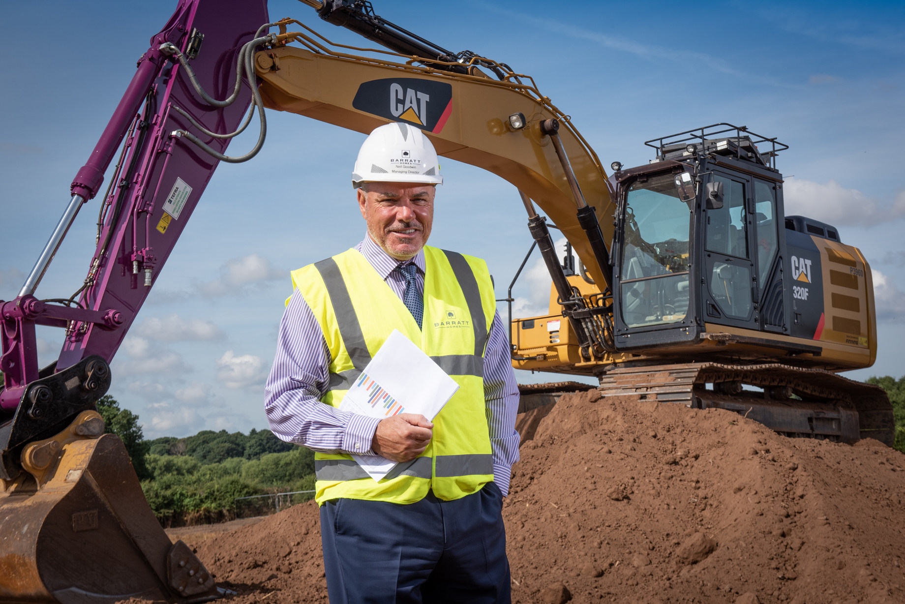 Neil Goodwin stood in front of digger