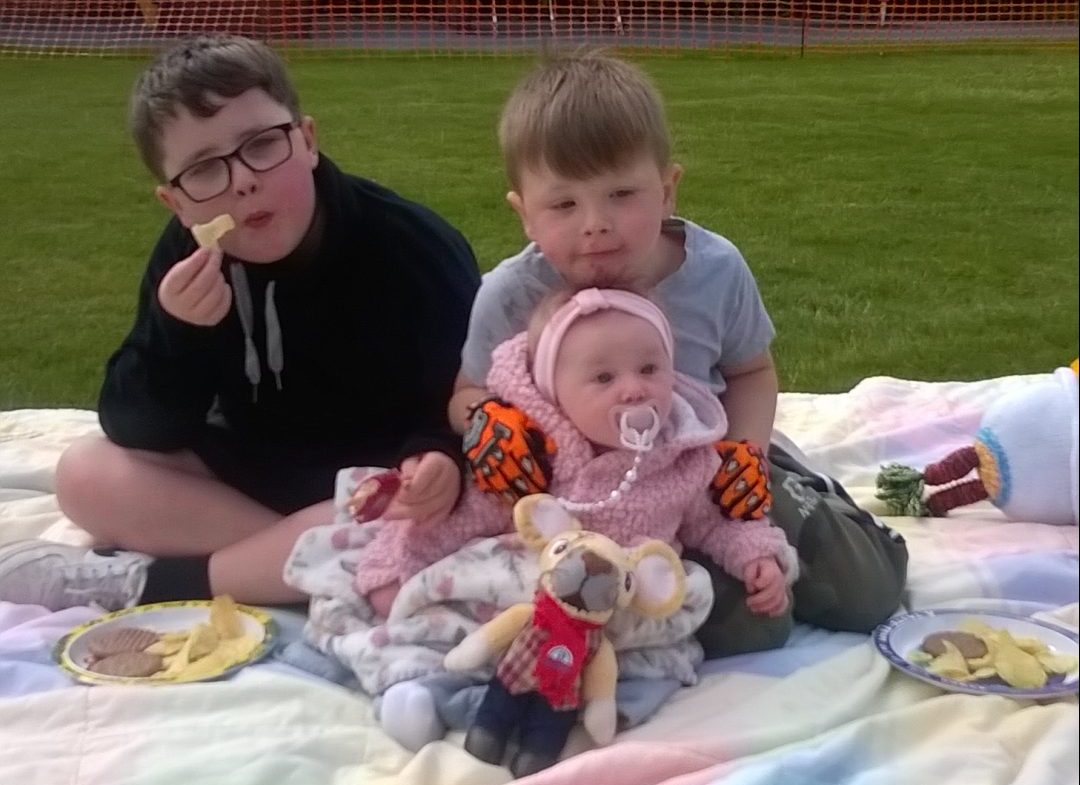 Children sat on blanket